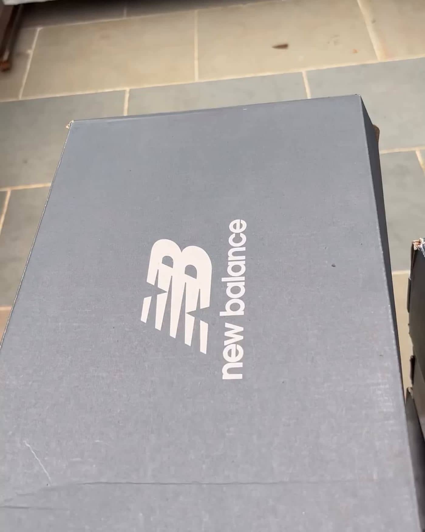 Shoeboxes stacked for wholesale dispatch at Originals By Shivaam